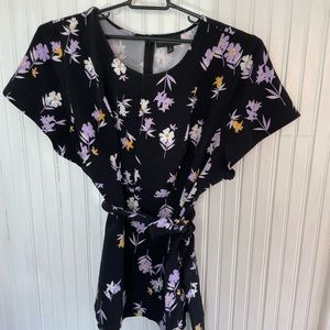 Black and floral, fit/flare blouse with Tie waist. Never worn.